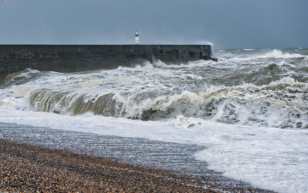 A stormy lighthouse standing against ocean weather and chaos